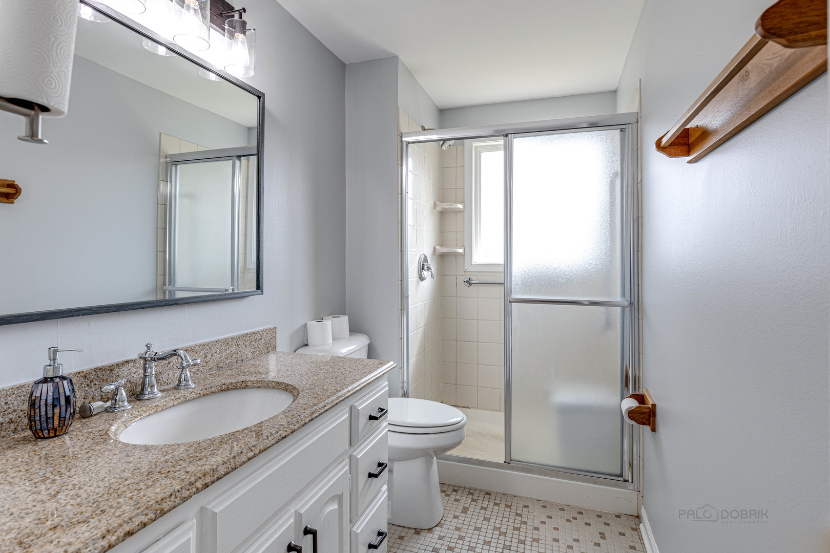 1100 Stoughton Court, Unit 1711 Schaumburg, IL 60193 - Photo 21 of 25 a bathroom with a granite countertop sink toilet and shower