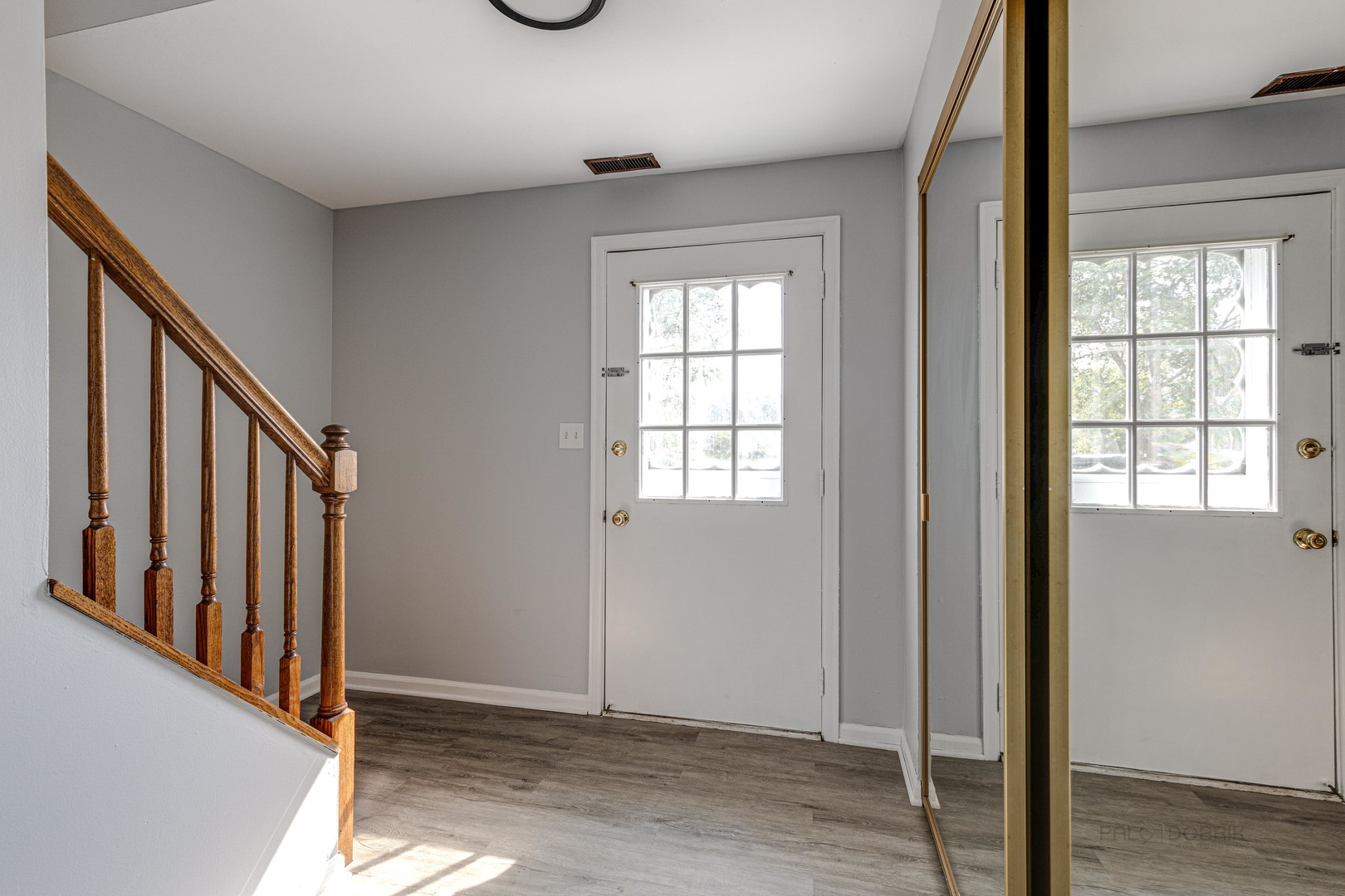 1100 Stoughton Court, Unit 1711 Schaumburg, IL 60193 - Photo 4 of 25 a view of an entryway with wooden floor