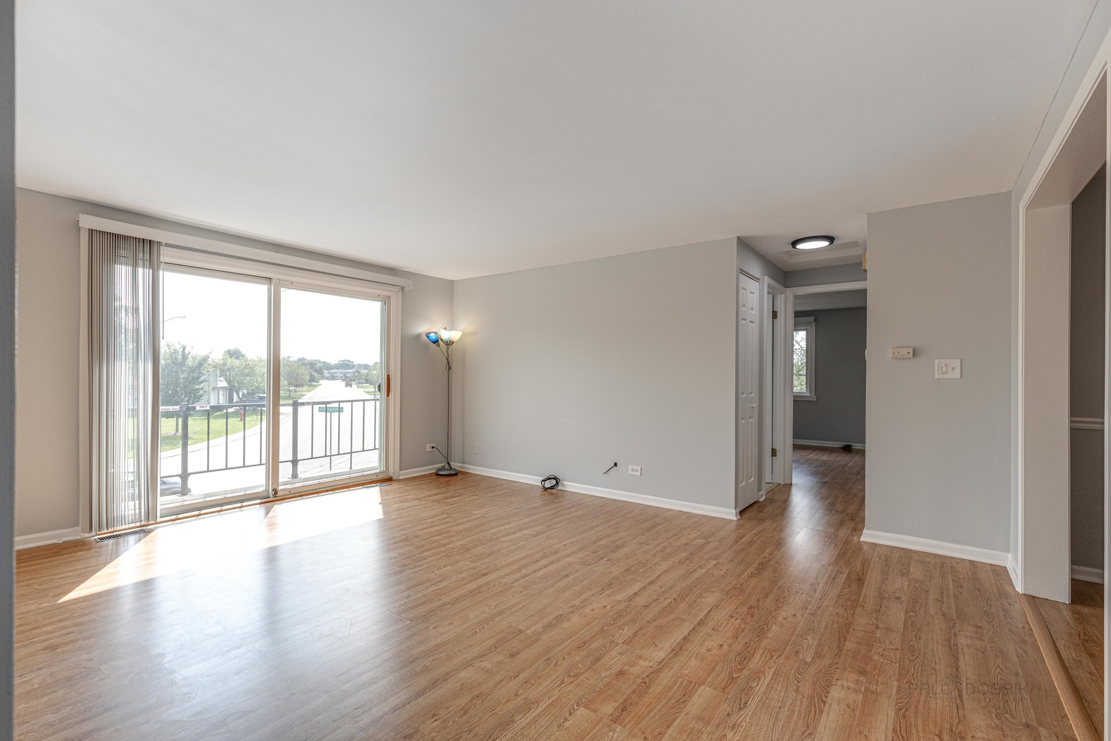 1100 Stoughton Court, Unit 1711 Schaumburg, IL 60193 - Photo 8 of 25 wooden floor in an empty room with a window