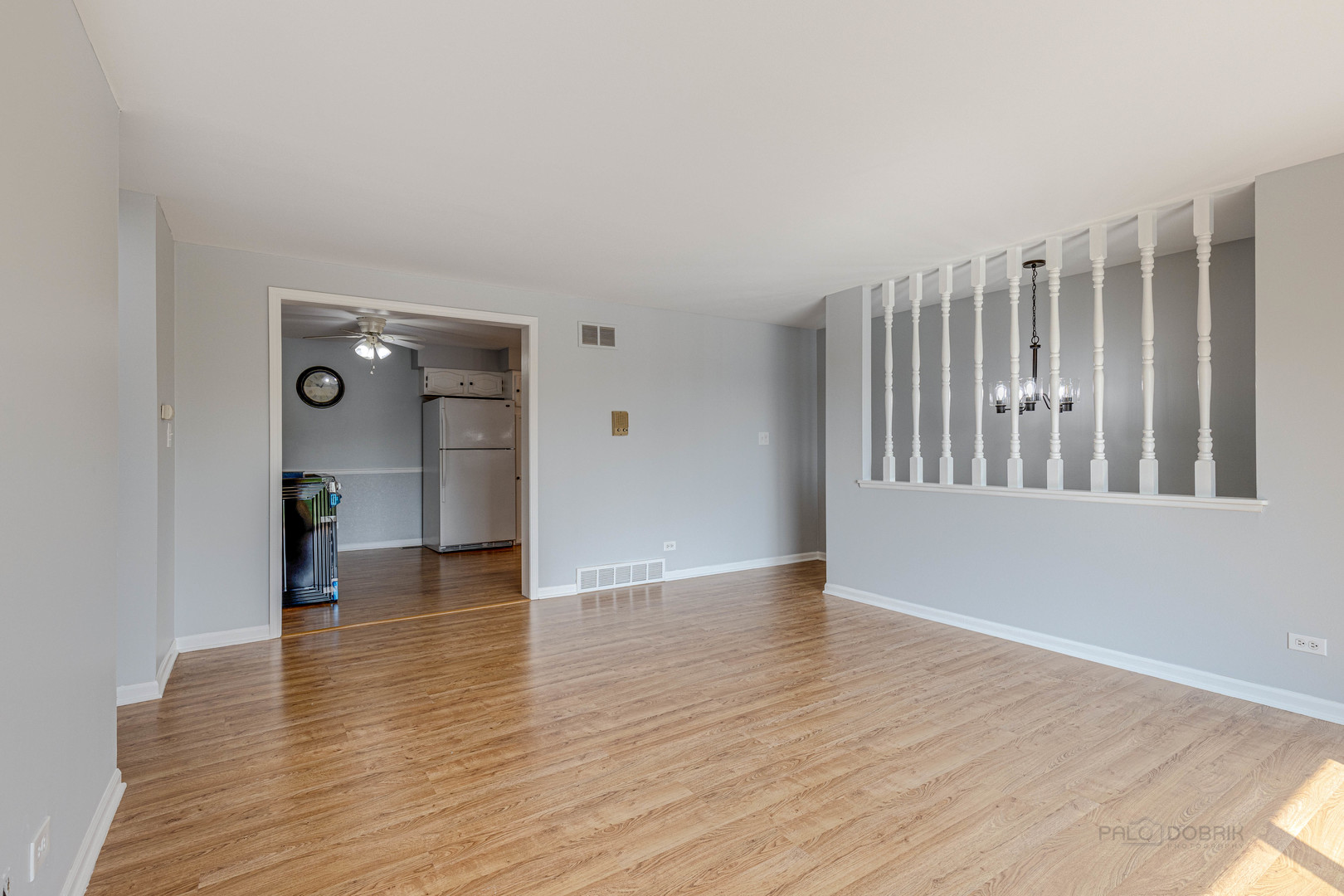 1100 Stoughton Court, Unit 1711 Schaumburg, IL 60193 - Photo 10 of 25 a view of an empty room with wooden floor and a window