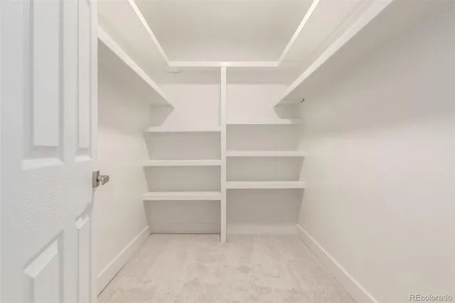 a bathroom with a granite countertop sink a toilet and a mirror