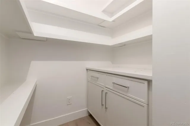 a bathroom with a toilet sink and shower