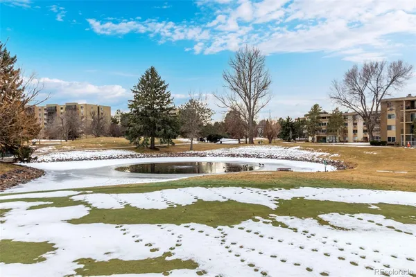 a view of lake with residential houses with outdoor space