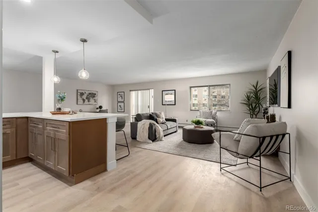 a kitchen with a refrigerator and windows