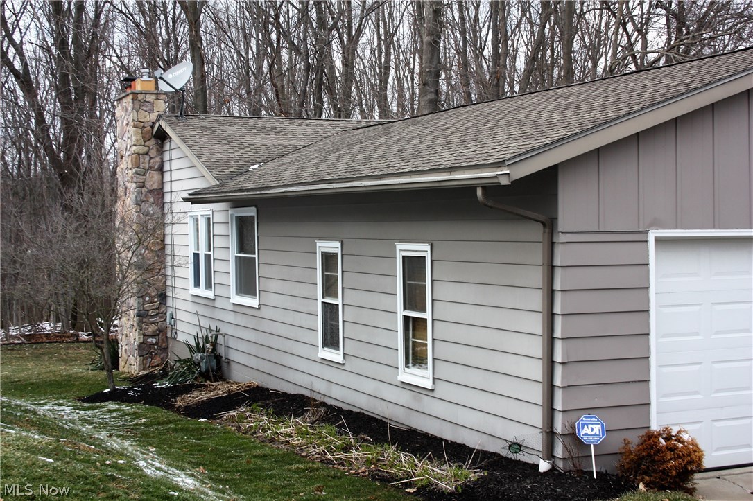 526 Garnette Road Akron, OH 44313 - Photo 24 of 28 2 car attached garage. Side view of home.