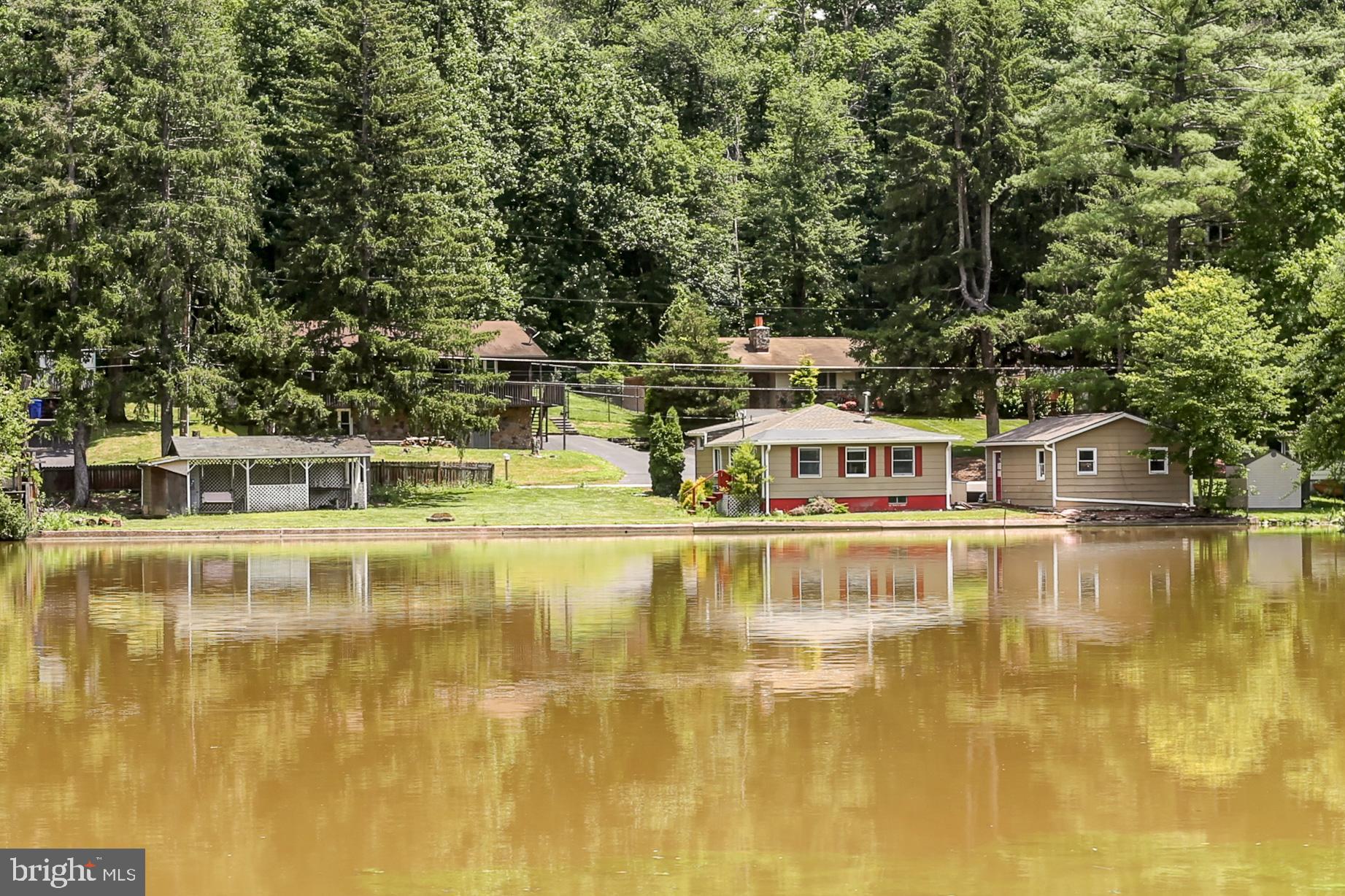 823 Silver Lake Road Lewisberry, PA 17339 - Photo 1 of 24 a view of a swimming pool with an outdoor seating