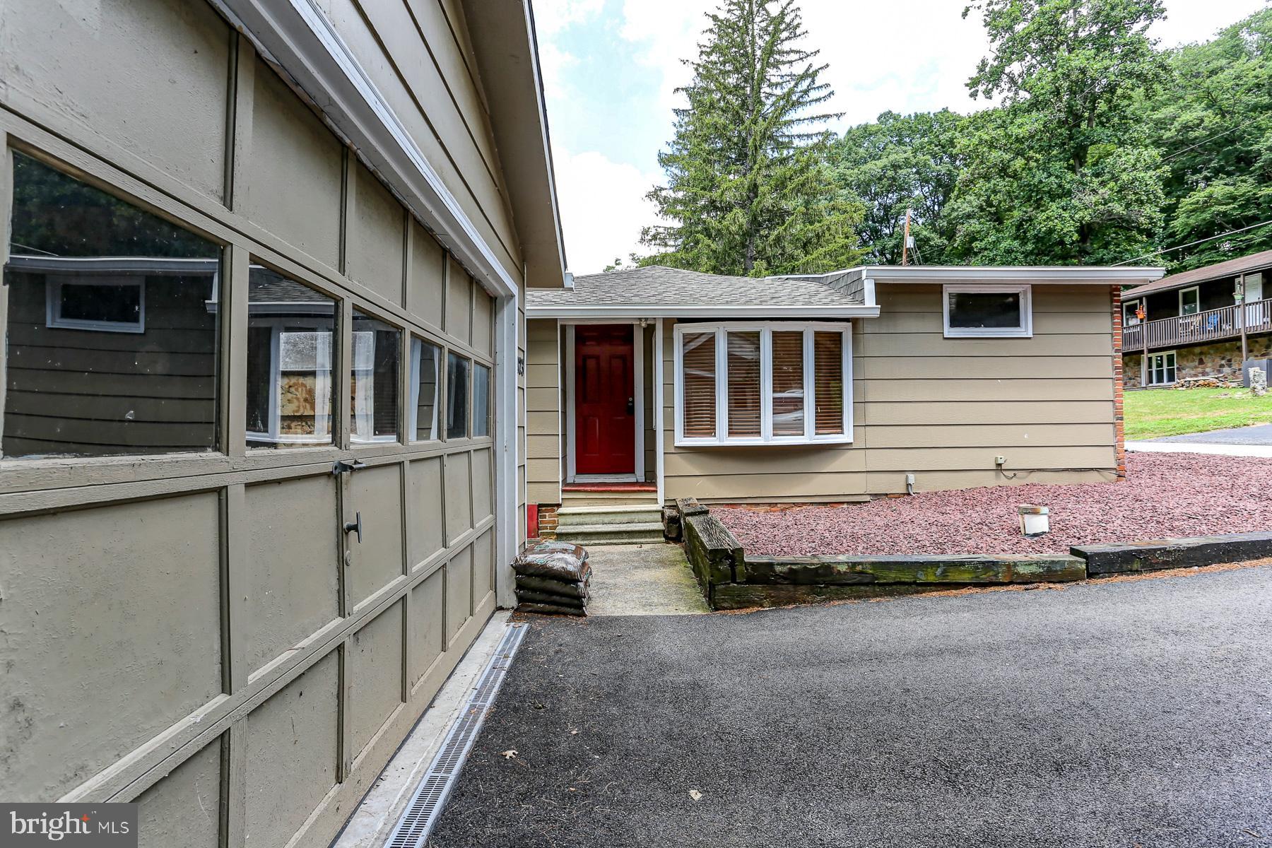 823 Silver Lake Road Lewisberry, PA 17339 - Photo 12 of 24 a front view of a house with a garden