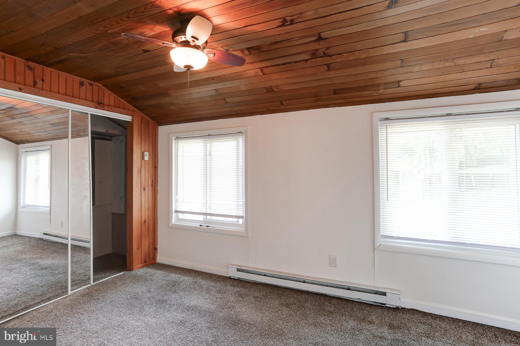823 Silver Lake Road Lewisberry, PA 17339 - Photo 16 of 24 wooden floor and window in an empty room