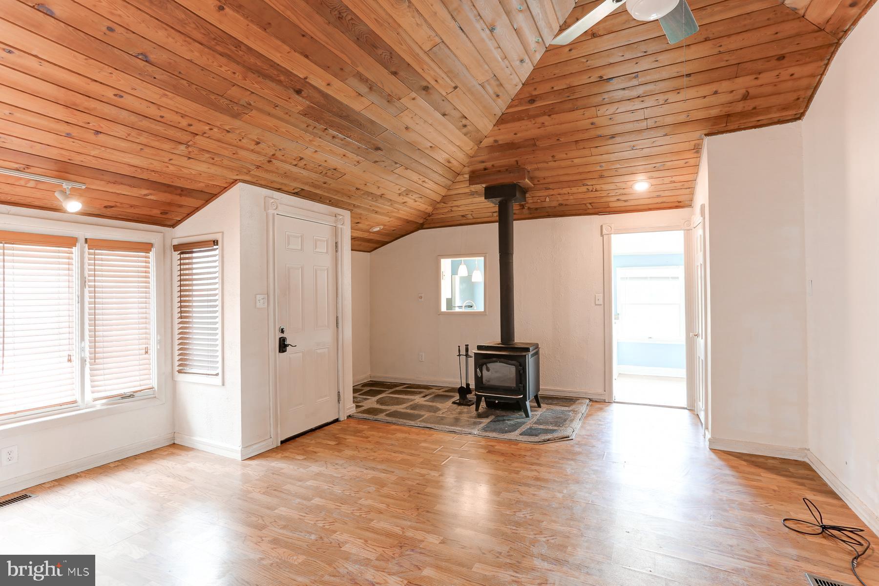 823 Silver Lake Road Lewisberry, PA 17339 - Photo 18 of 24 a view of a livingroom with wooden floor and a large window