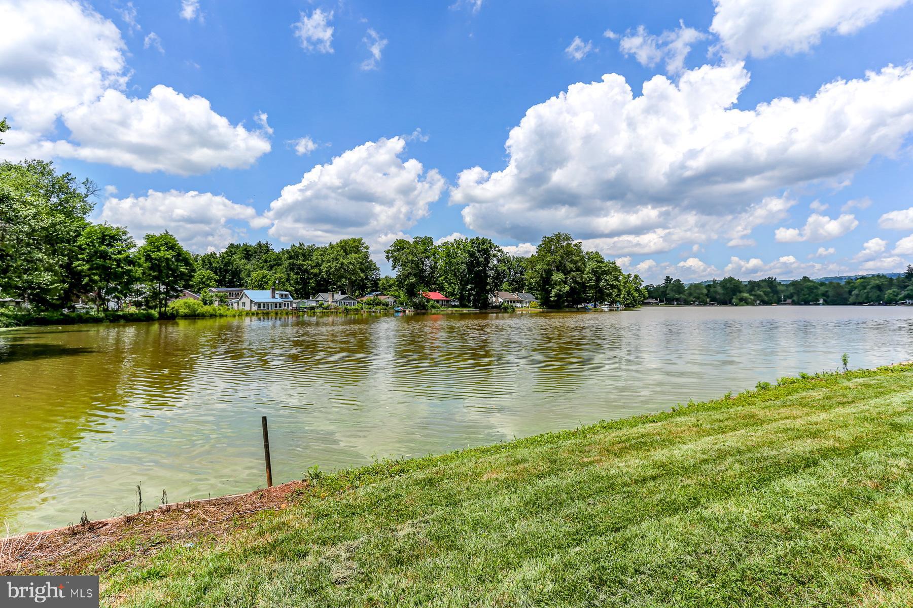 823 Silver Lake Road Lewisberry, PA 17339 - Photo 3 of 24 a view of a lake from a yard