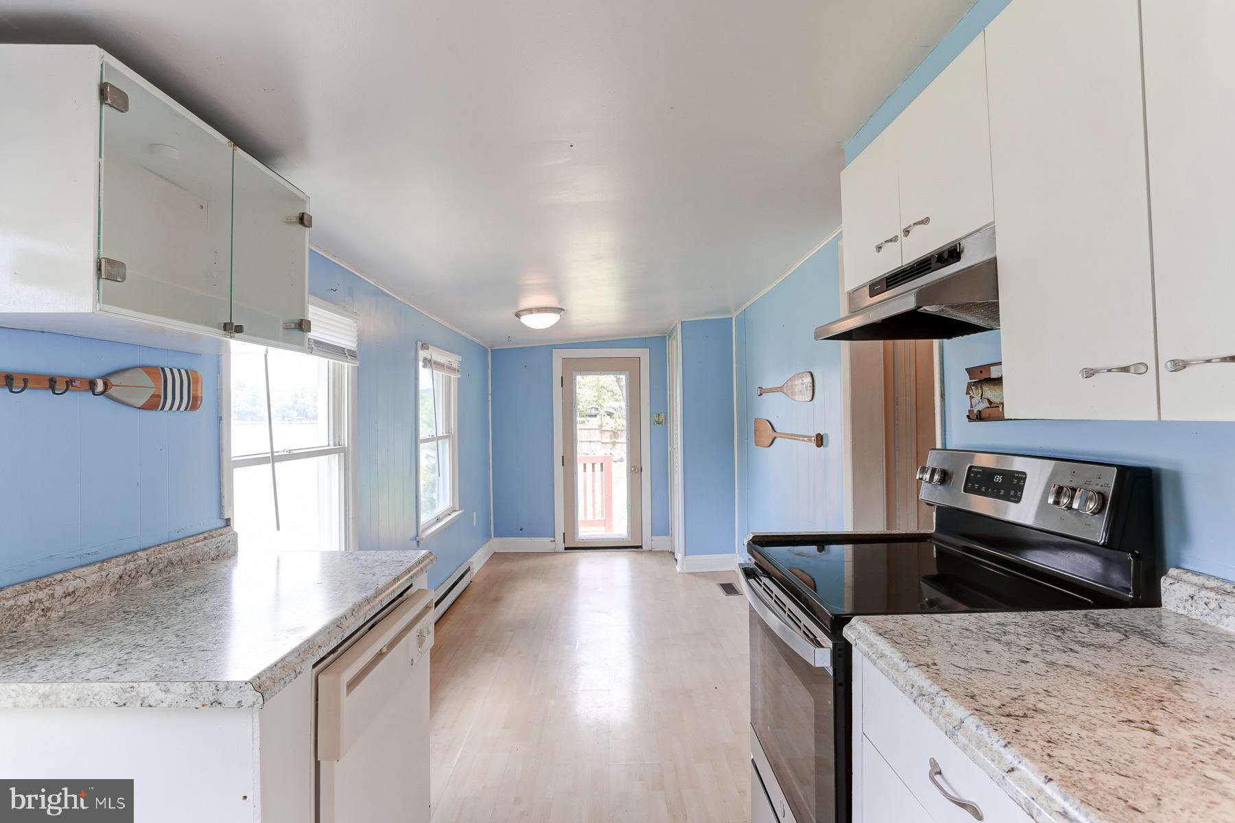 823 Silver Lake Road Lewisberry, PA 17339 - Photo 9 of 24 a kitchen with granite countertop a stove and a sink