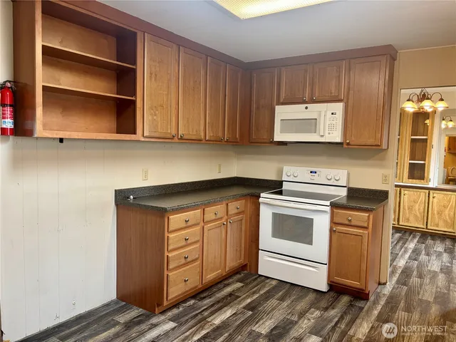 a kitchen with stainless steel appliances granite countertop a stove and a refrigerator