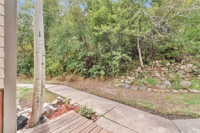 a view of outdoor space with wooden floor
