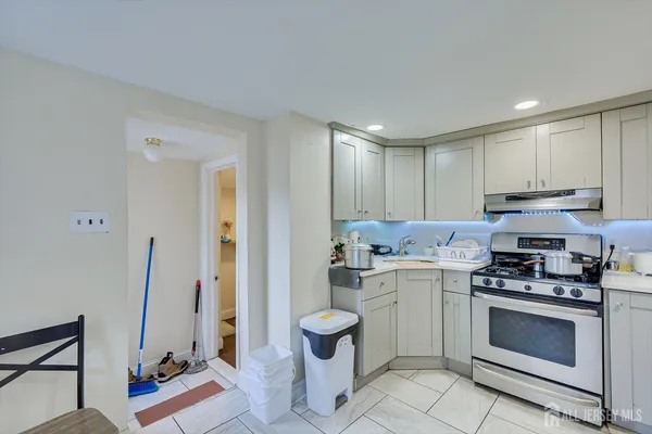 a kitchen with a stove and a refrigerator