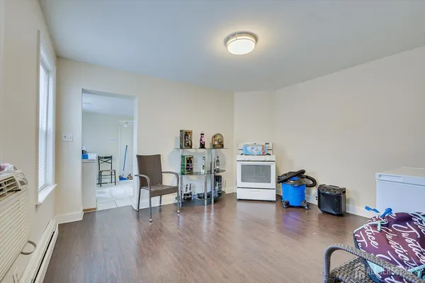 a view of a livingroom with furniture and an empty room