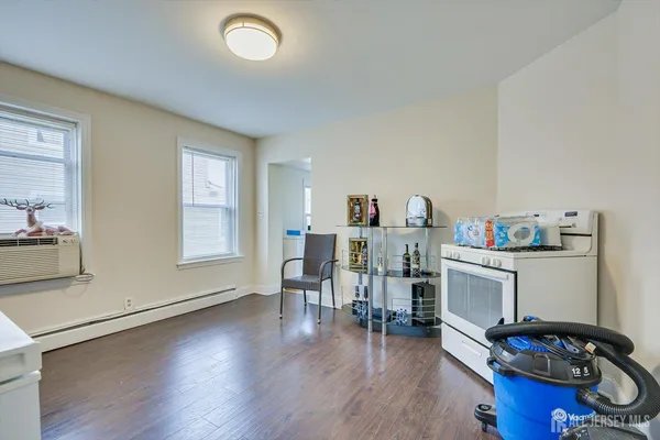 a view of a workspace with furniture and a kitchen