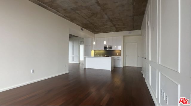 a view of a electric appliances in kitchen and a window