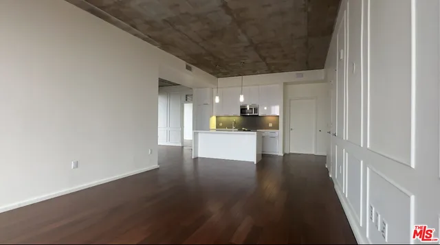 a view of a electric appliances in kitchen and a window