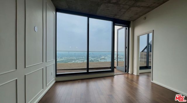 a view of a glass door and an empty room