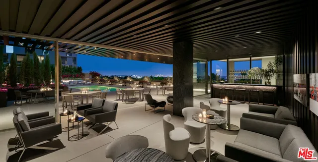 a outdoor living space with furniture and a grill