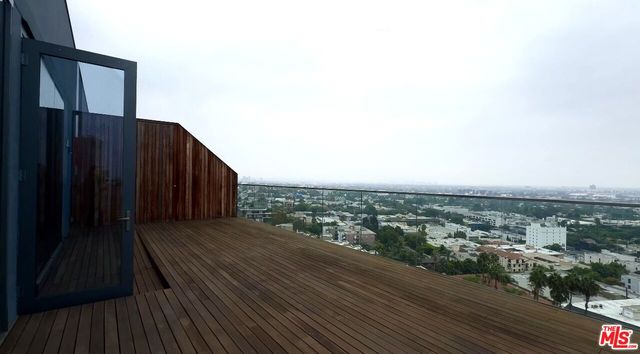 an outdoor view of building with wooden floor