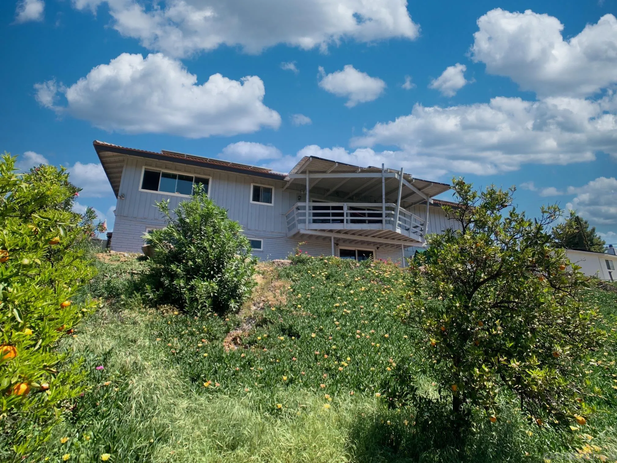 1958 Highlands View Road Alpine, CA 91901 - Photo 53 of 58 a front view of a house with garden