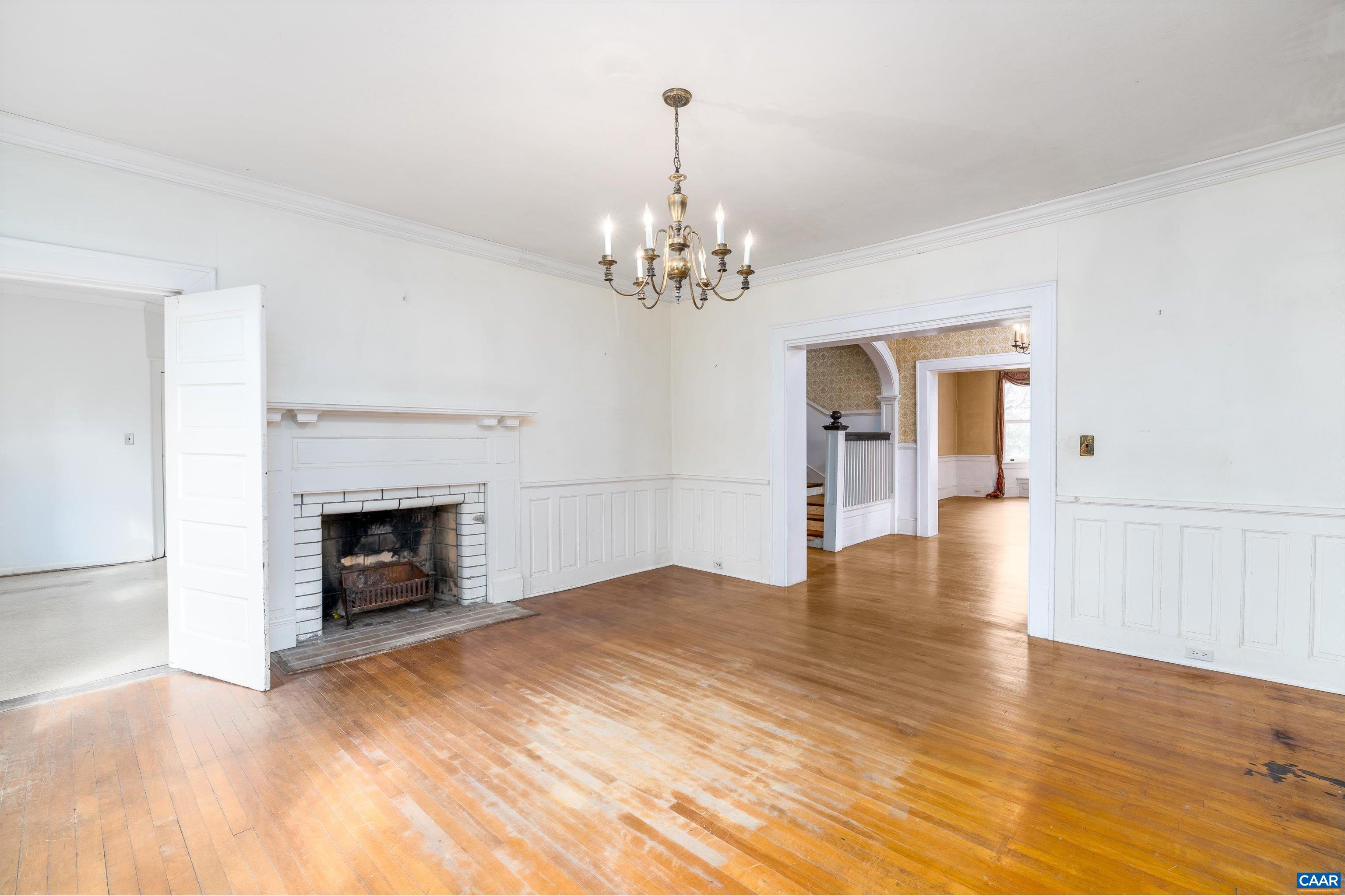 278 James River Road Scottsville, VA 24590 - Photo 12 of 59 a view of a livingroom with wooden floor and a fireplace