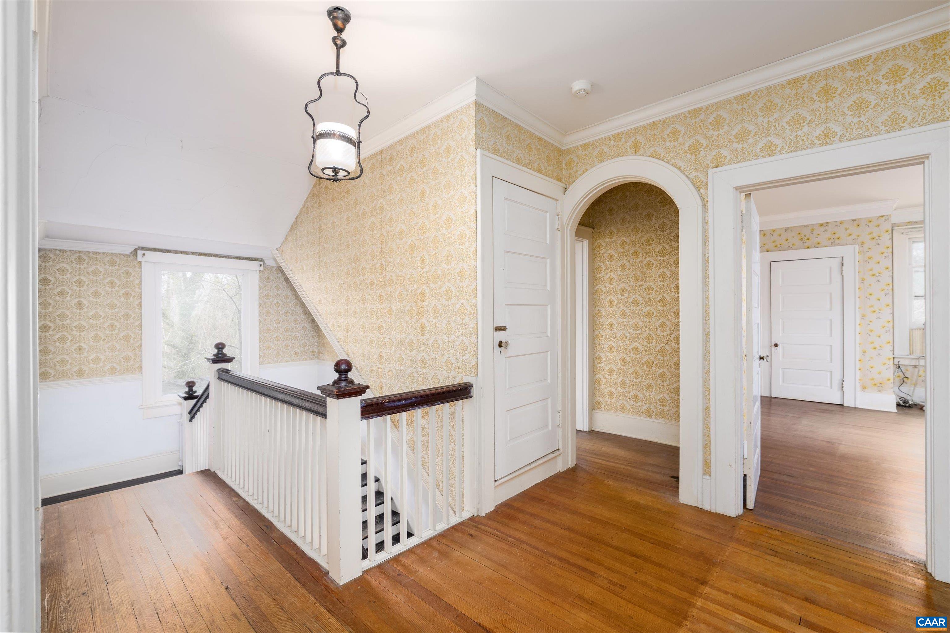 278 James River Road Scottsville, VA 24590 - Photo 26 of 59 a view of a hallway with wooden floor and staircase