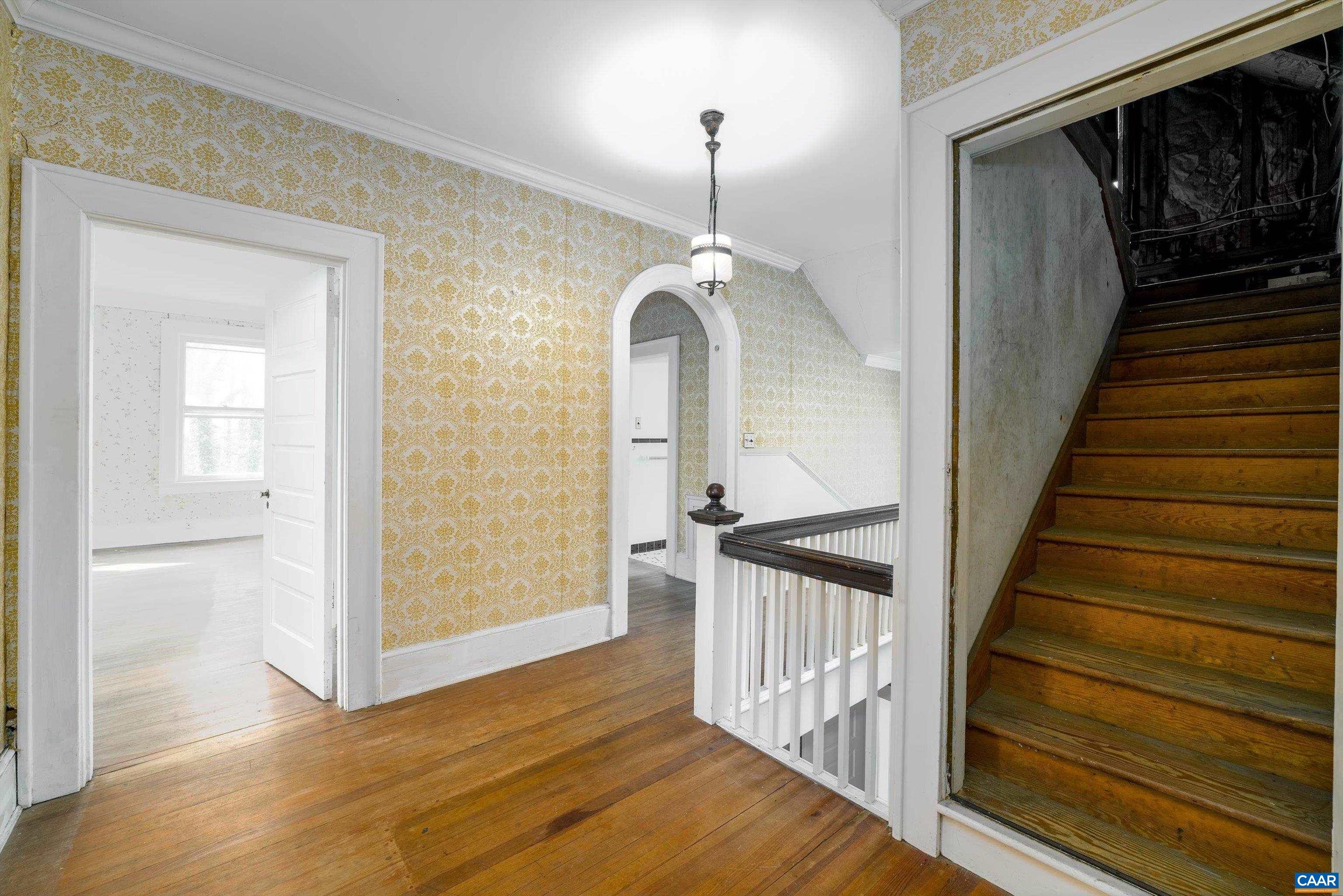 278 James River Road Scottsville, VA 24590 - Photo 39 of 59 a view of a hallway with wooden floor and staircase