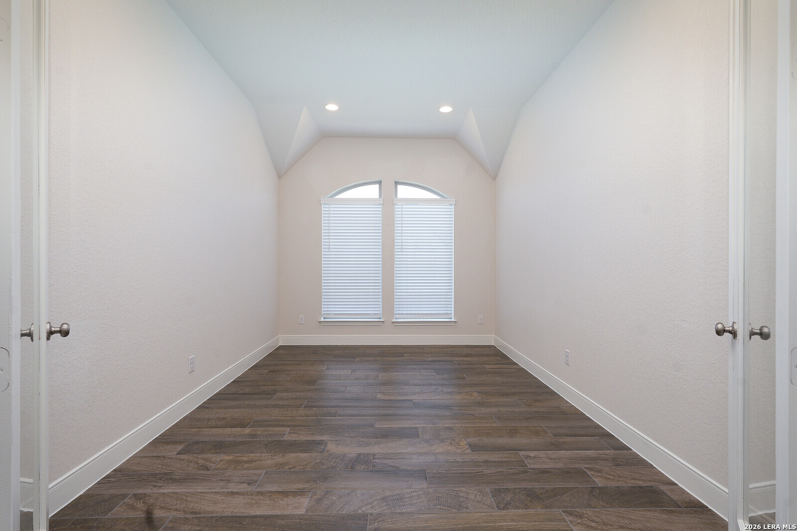 3654 Braford Way Bulverde, TX 78163 - Photo 14 of 32 an empty room with wooden floor and window