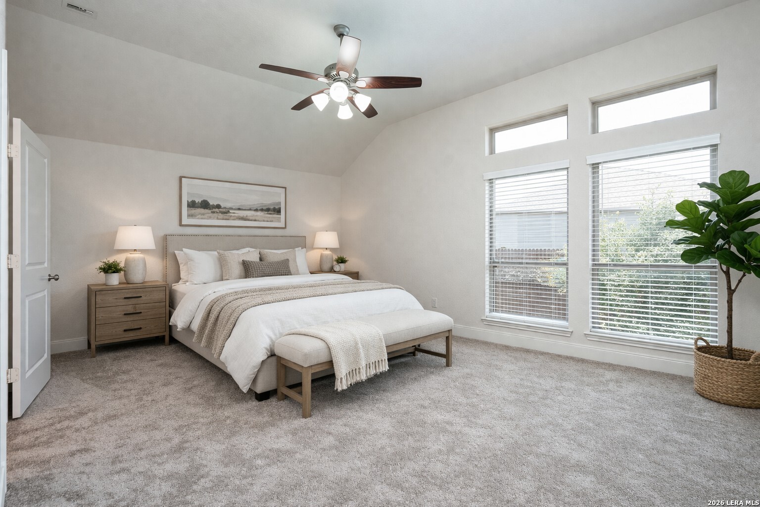 3654 Braford Way Bulverde, TX 78163 - Photo 18 of 32 a spacious bedroom with a bed and a chandelier