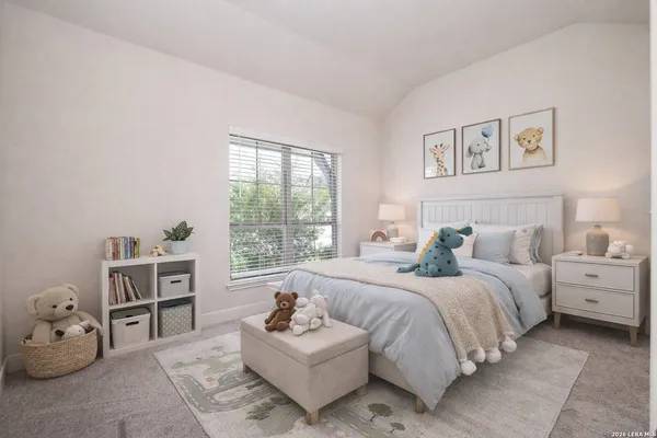 a bedroom with a bed and a couch