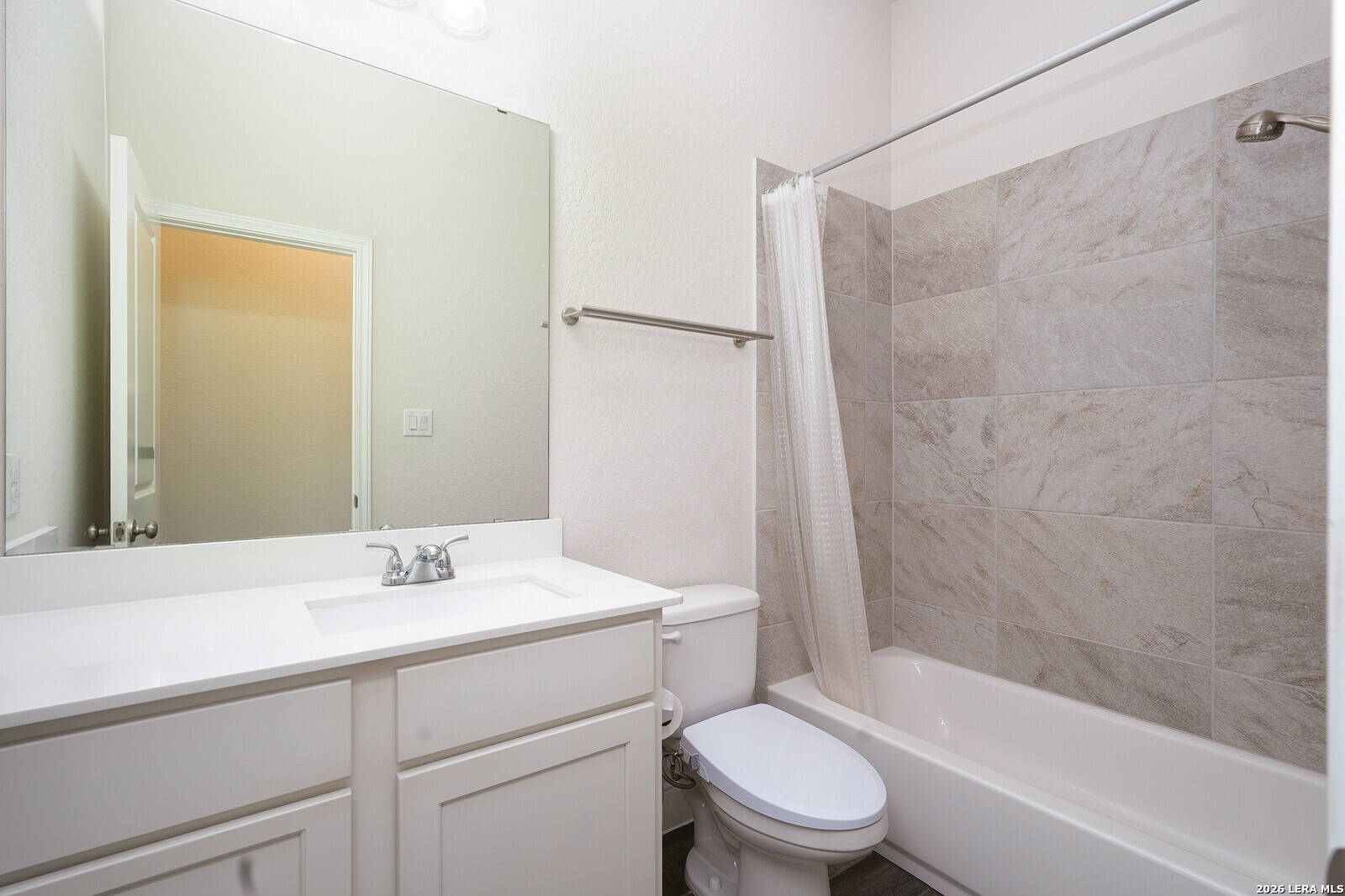 3654 Braford Way Bulverde, TX 78163 - Photo 23 of 32 a bathroom with a sink toilet and shower