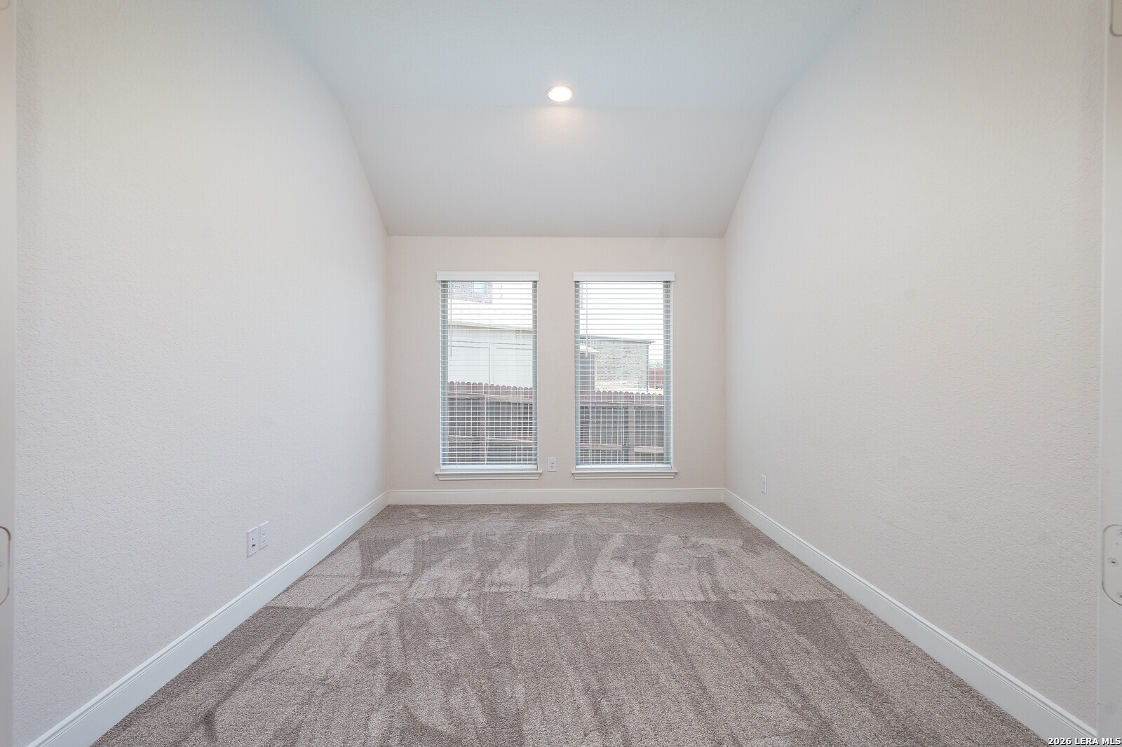 3654 Braford Way Bulverde, TX 78163 - Photo 26 of 32 an empty room with wooden floor and windows