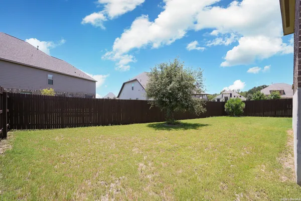 a view of back yard of the house