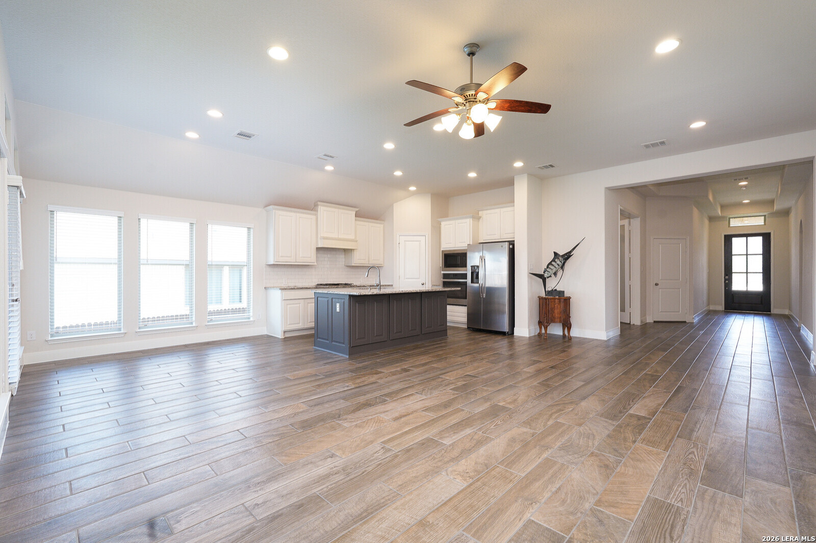 3654 Braford Way Bulverde, TX 78163 - Photo 6 of 32 a view of a kitchen with a sink and a window