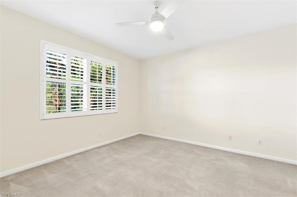 7092 Timberland Circle, Unit 1101 Naples, FL 34109 - Photo 17 of 48 an empty room with a window