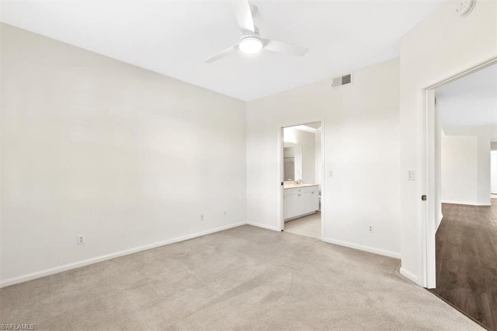 7092 Timberland Circle, Unit 1101 Naples, FL 34109 - Photo 18 of 48 an empty room with a bathroom