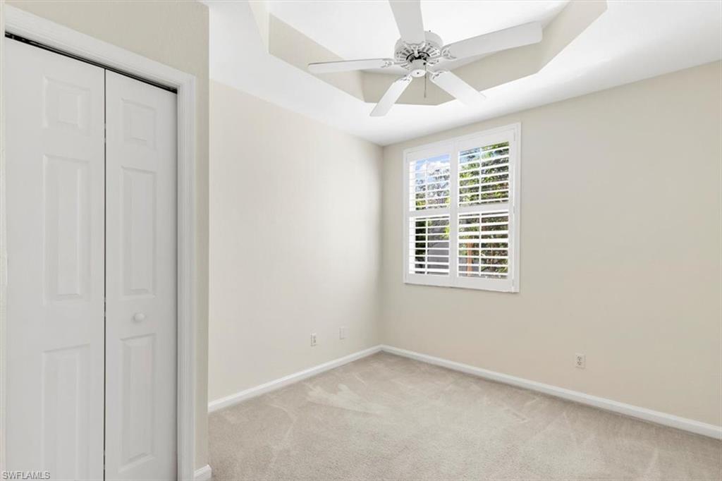 7092 Timberland Circle, Unit 1101 Naples, FL 34109 - Photo 22 of 48 an empty room with a window and a fan