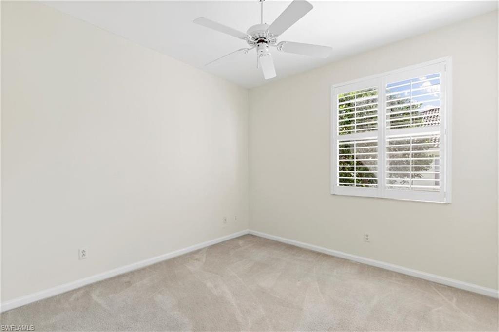 7092 Timberland Circle, Unit 1101 Naples, FL 34109 - Photo 24 of 48 an empty room with a window and a fan