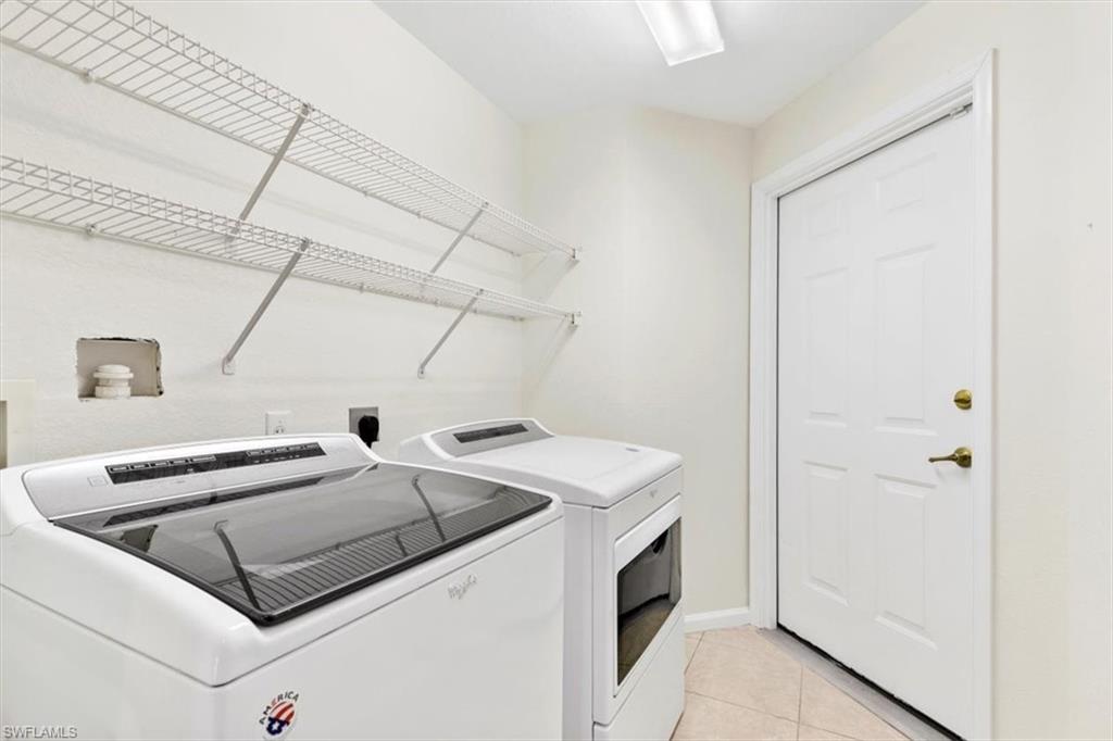 7092 Timberland Circle, Unit 1101 Naples, FL 34109 - Photo 26 of 48 a utility room with dryer and washer
