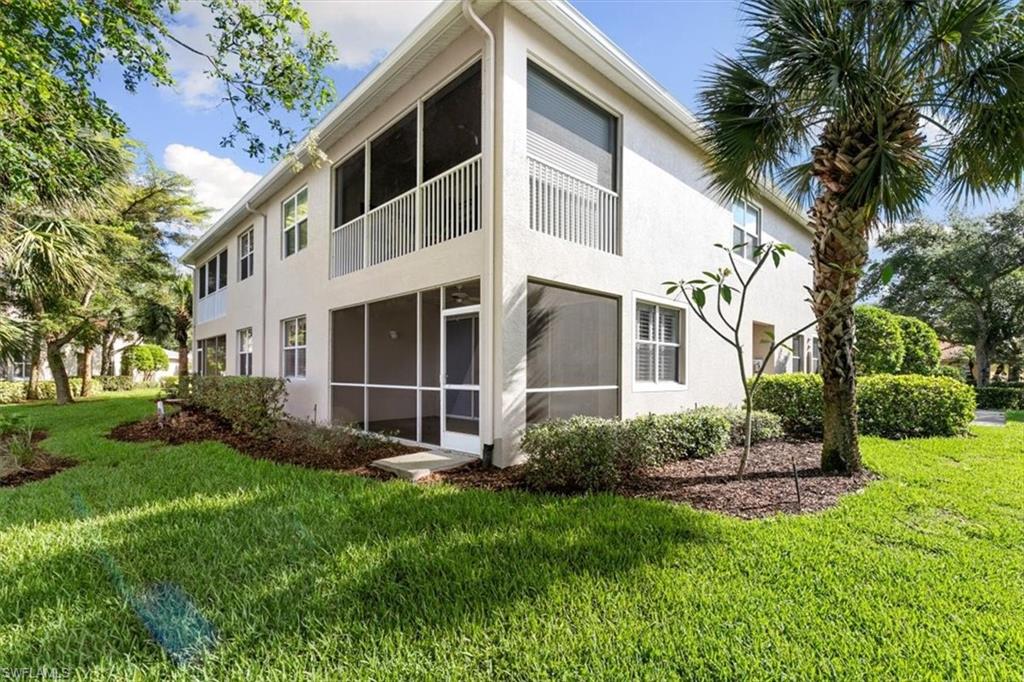 7092 Timberland Circle, Unit 1101 Naples, FL 34109 - Photo 28 of 48 a view of a back yard of the house