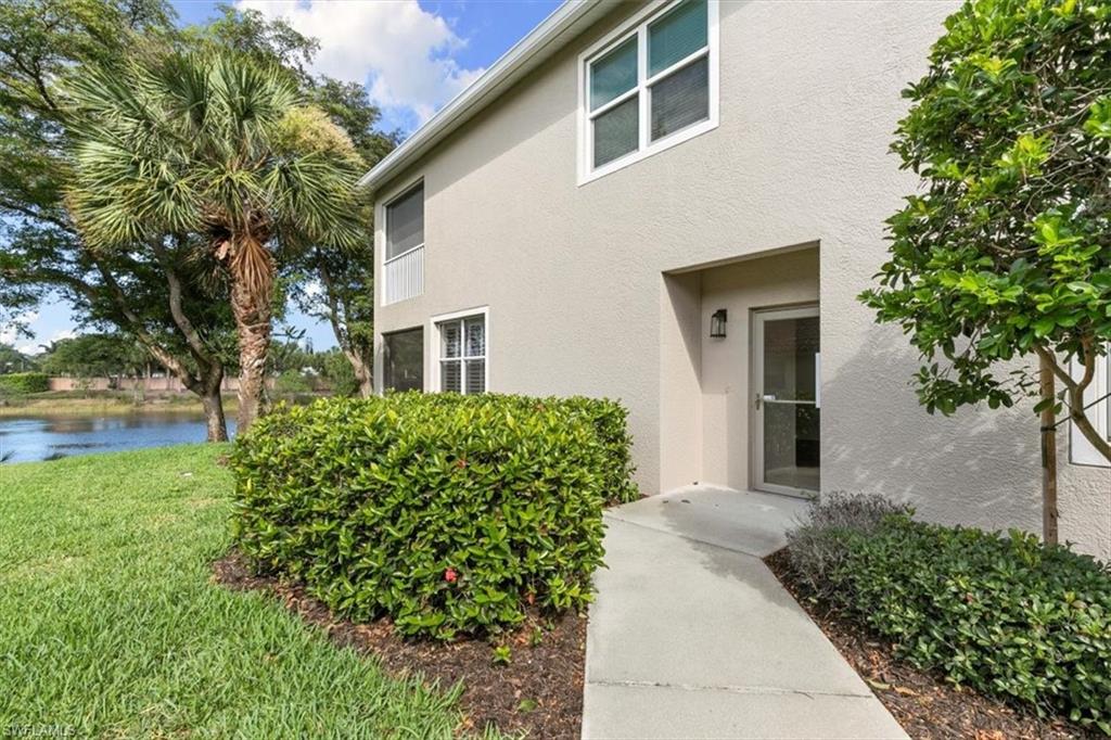 7092 Timberland Circle, Unit 1101 Naples, FL 34109 - Photo 29 of 48 a front view of a house with garden