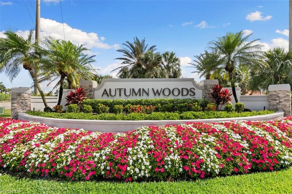 7092 Timberland Circle, Unit 1101 Naples, FL 34109 - Photo 30 of 48 a view of outdoor space with flowers and tree