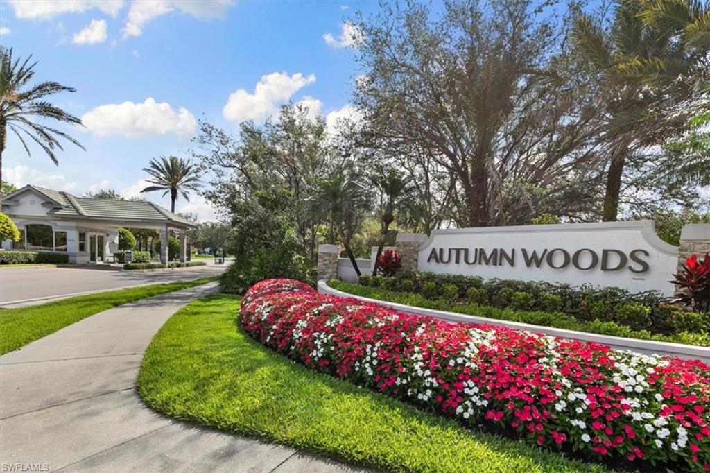 7092 Timberland Circle, Unit 1101 Naples, FL 34109 - Photo 31 of 48 a sign that is sitting in front of flowers