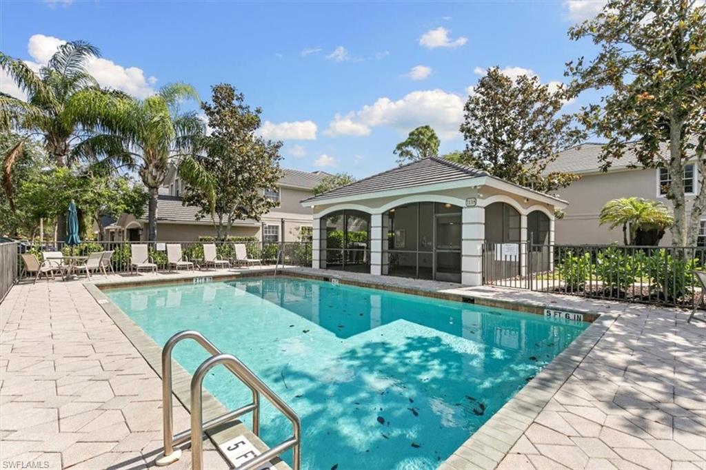 7092 Timberland Circle, Unit 1101 Naples, FL 34109 - Photo 37 of 48 a front view of house with outdoor seating and swimming pool