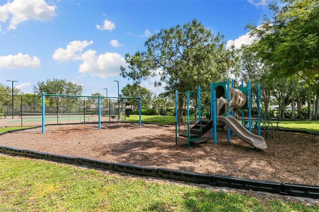 7092 Timberland Circle, Unit 1101 Naples, FL 34109 - Photo 44 of 48 a view of a park with swings