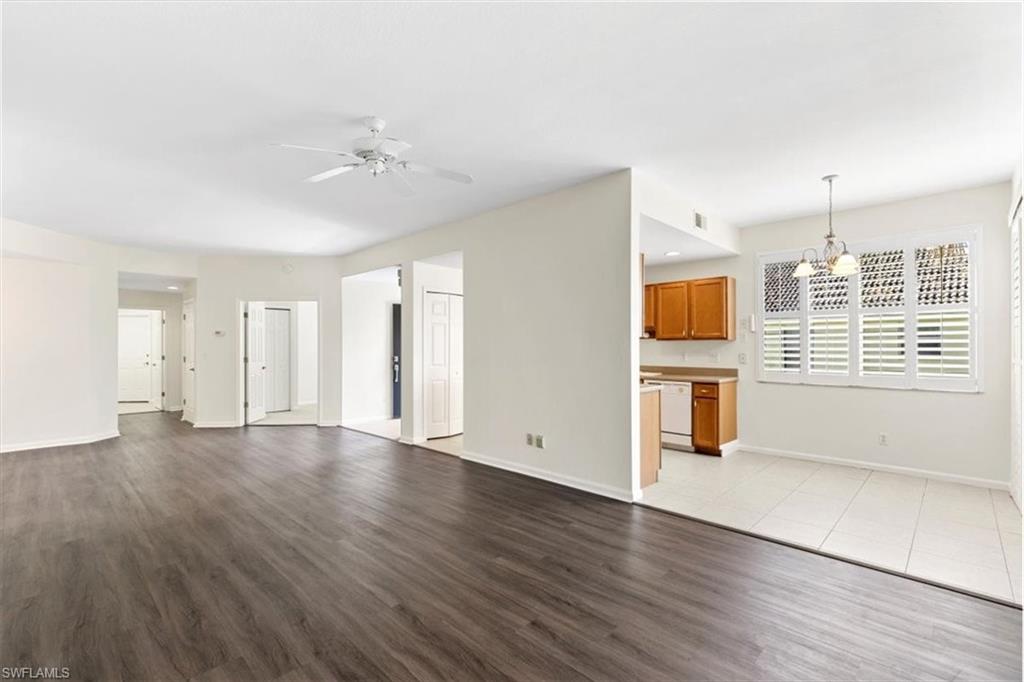 7092 Timberland Circle, Unit 1101 Naples, FL 34109 - Photo 6 of 48 a view of a kitchen with wooden floor and a sink