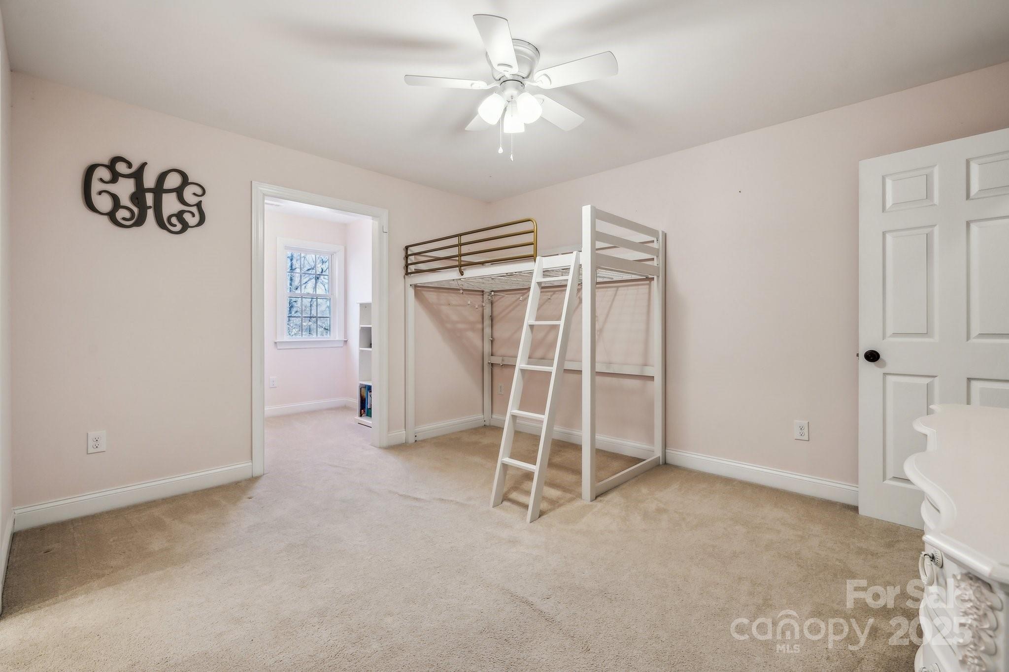 4006 Sincerity Road Monroe, NC 28110 - Photo 17 of 36 a view of an empty room with a ceiling fan