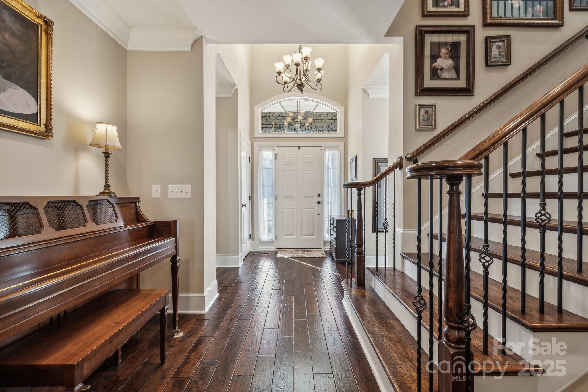 4006 Sincerity Road Monroe, NC 28110 - Photo 3 of 36 a view of a hallway with wooden floor and staircase